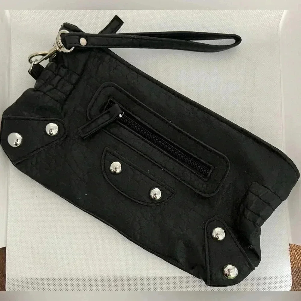 Chateau | studded faux leather wristlet